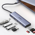 HUB Ugreen CM511 20956A 6in1 USB-C - HDMI / 3x USB-A 3.0 / SD/TF kortelių skaitytuvas - pilkas -- USB Hubs