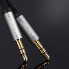 Ugreen plokščias AUX garso kabelis 3.5mm mini jack 1m sidabrinis (10597) -- Audio Cables