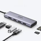 Ugreen daugiafunkcis HUB USB Type C - 3x USB 3.2 Gen 1 / HDMI 4K 60Hz / SD ir TF kortelių skaitytuvas pilkas (60383...