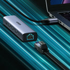 Ugreen daugiafunkcis adapteris HUB USB 3.0 - 3 x USB / Ethernet RJ-45 / USB Type C PD pilkas (CM475) -- USB Hubs